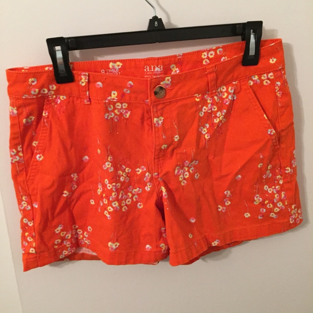 Bright orange shorts with summer flowers